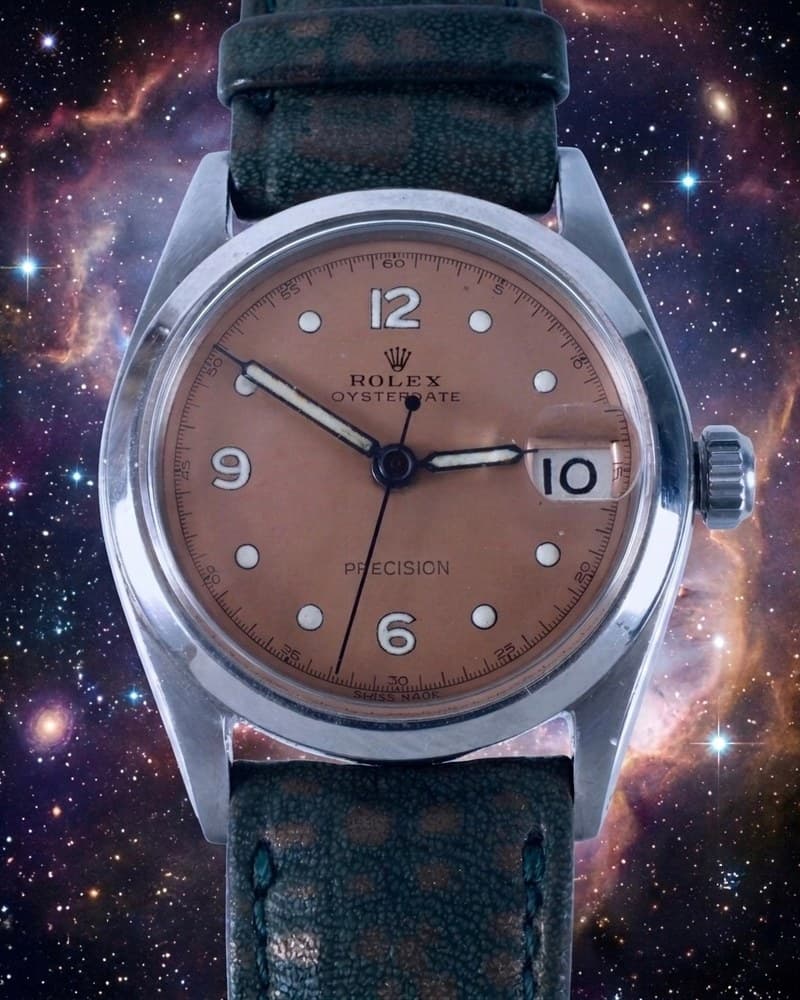 The Rolex Oysterdate, its tropical dial against a nebula.