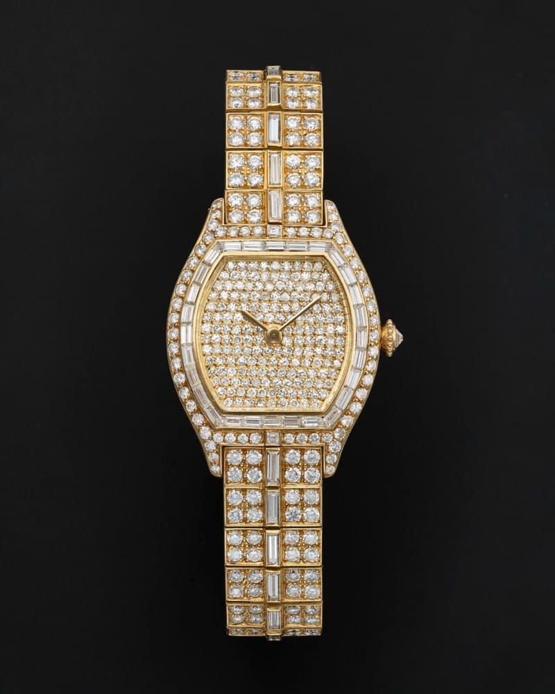 The Cartier Tortue, its case and bracelet set with diamonds.