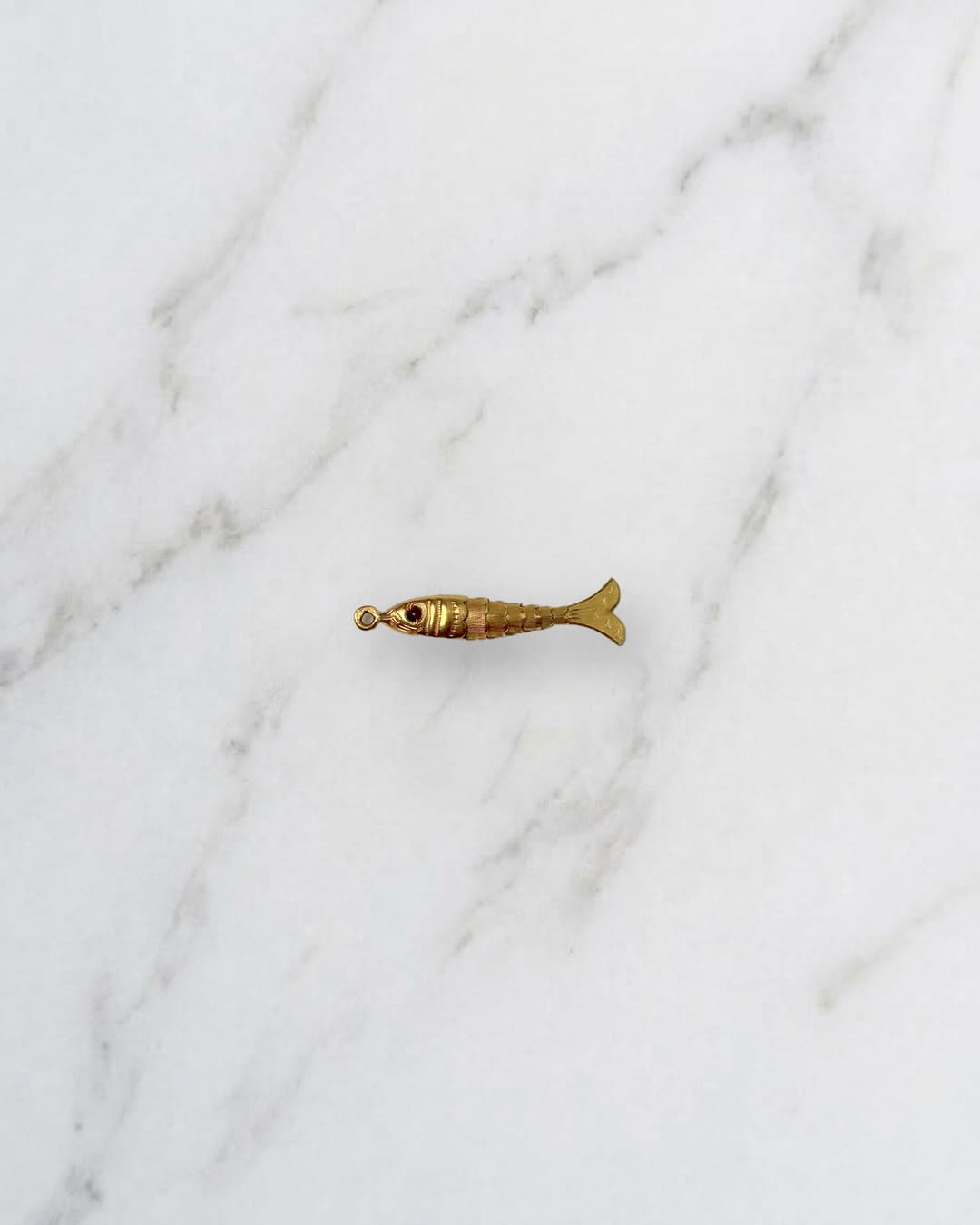 Small articulated fish charm